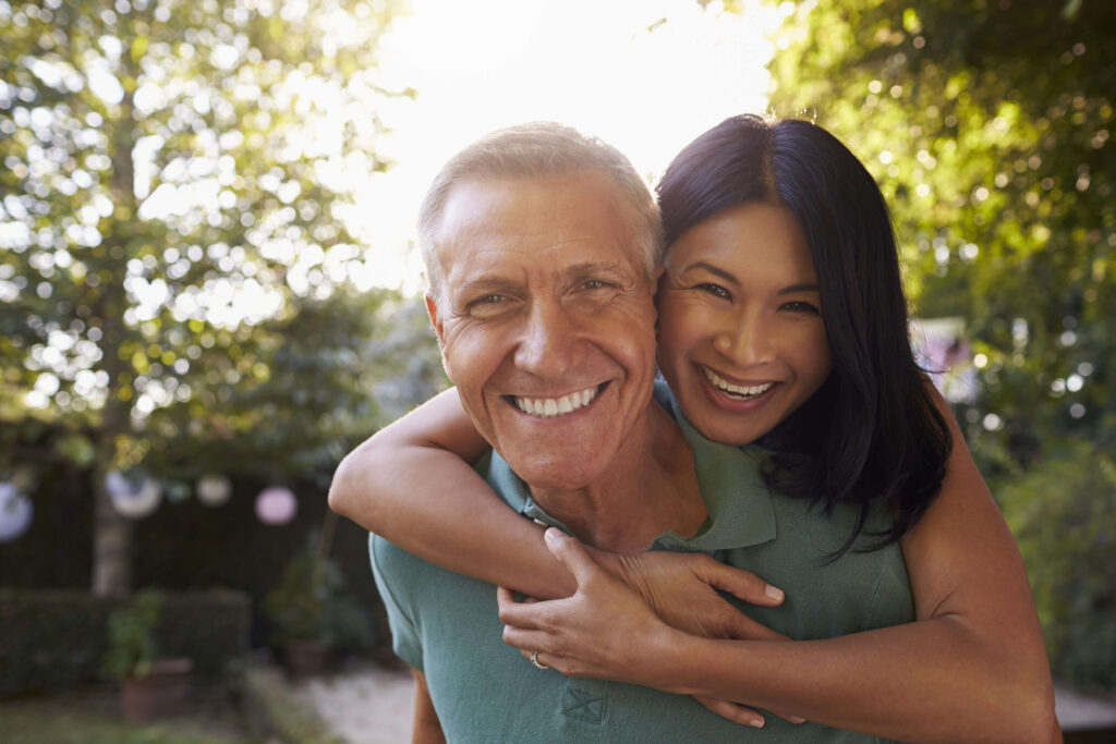 Man and woman hugging while taking a photo